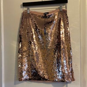 New w/ tags. Express, size S, rose gold sequin skirt. Lined, hidden side zipper.
